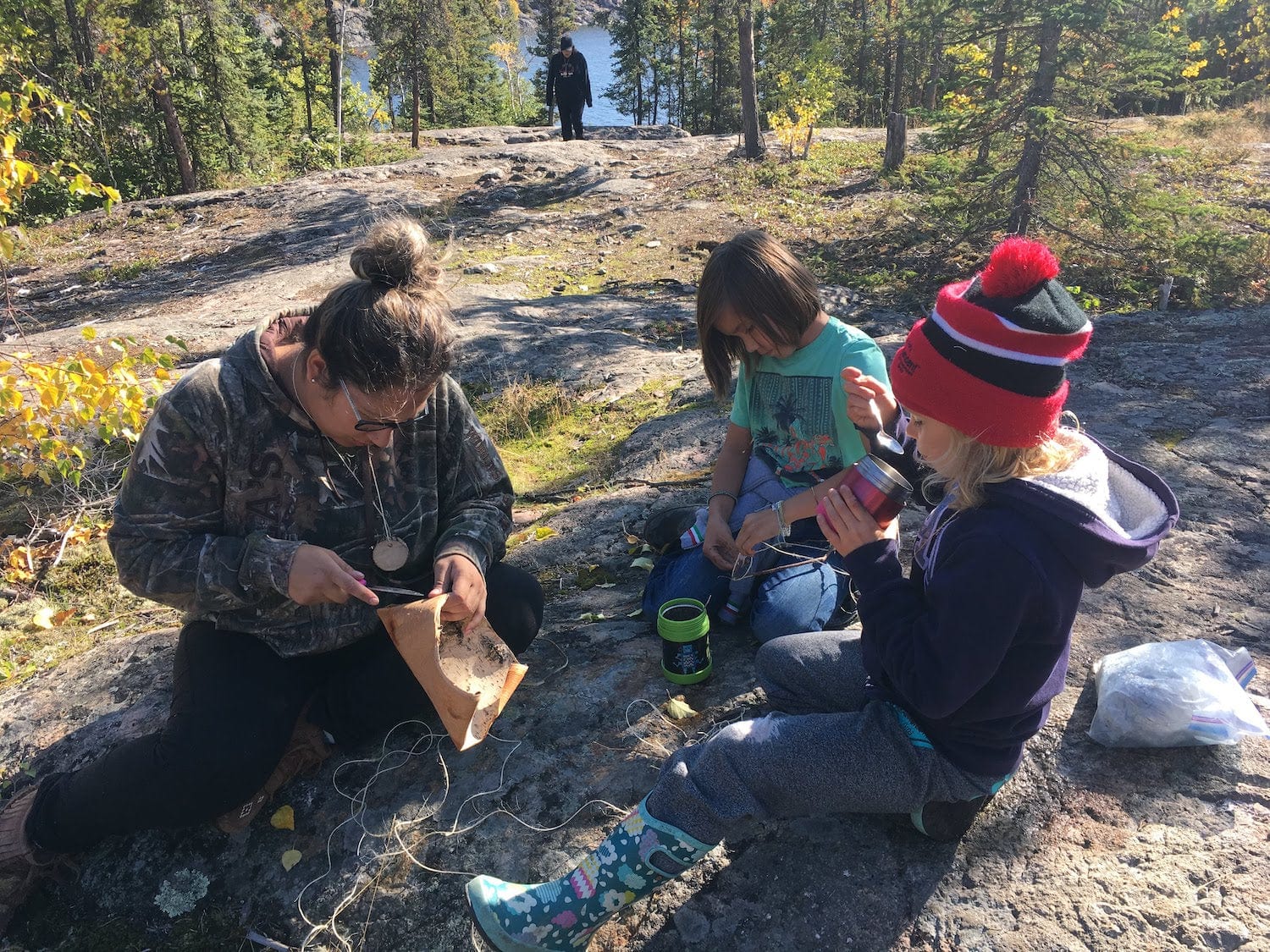 Two children learning outdoors through Aurora Heat affiliate programs