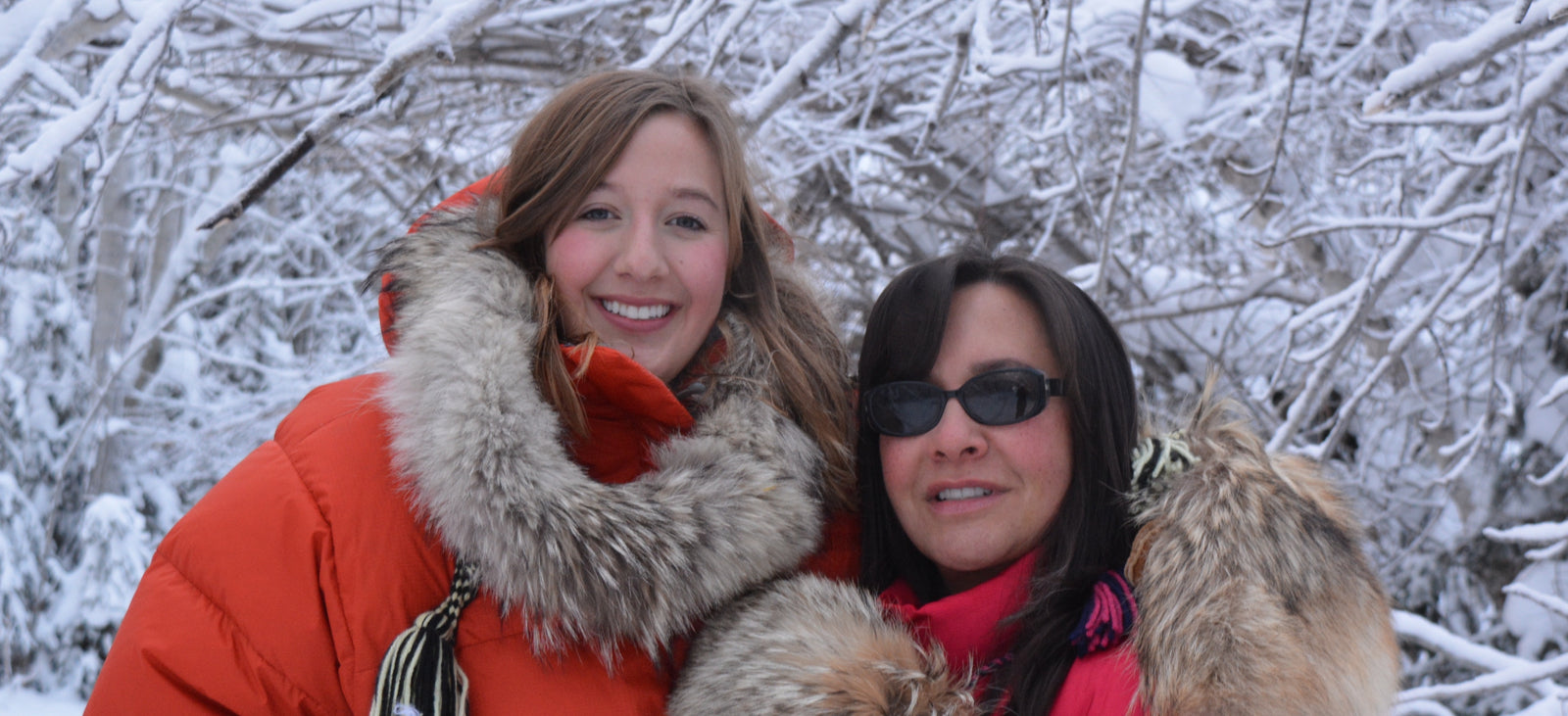 Brenda Dragon, founder of Aurora Heat next to her daughter Chloe in winter time dressed in fur