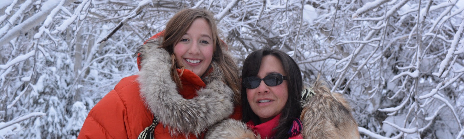 Brenda Dragon and daughter Chloe stand in cold wrapped in fur