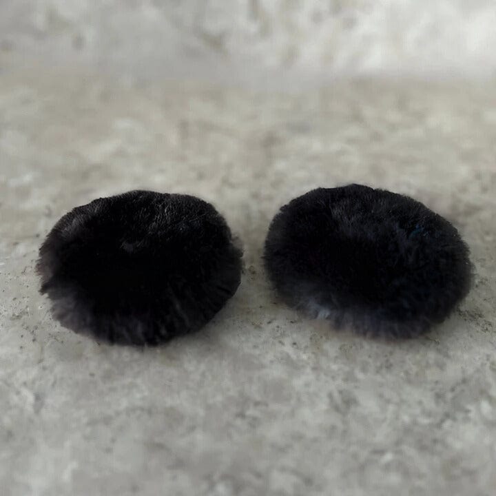 Reusable black fur pocket warmers